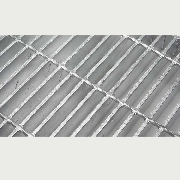 Close-up of forge-welded crossing between bearing bar and twisted cross bar on galvanized steel grating